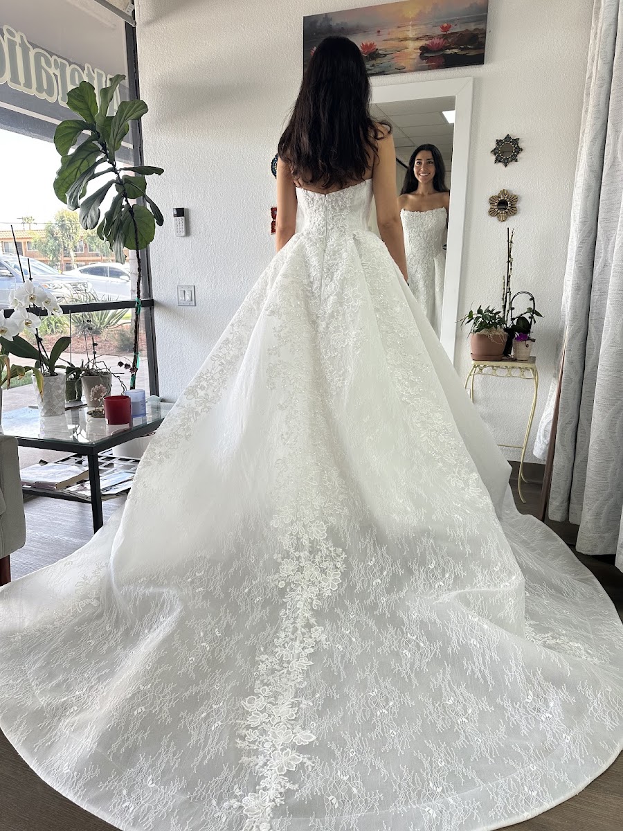 Satin wedding gown with an embroidered ball gown skirt
