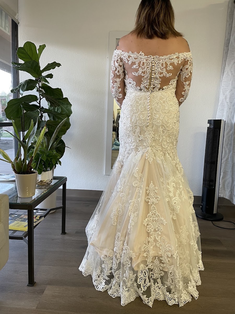 Off-the-shoulder lace wedding gown with sheer lace sleeves